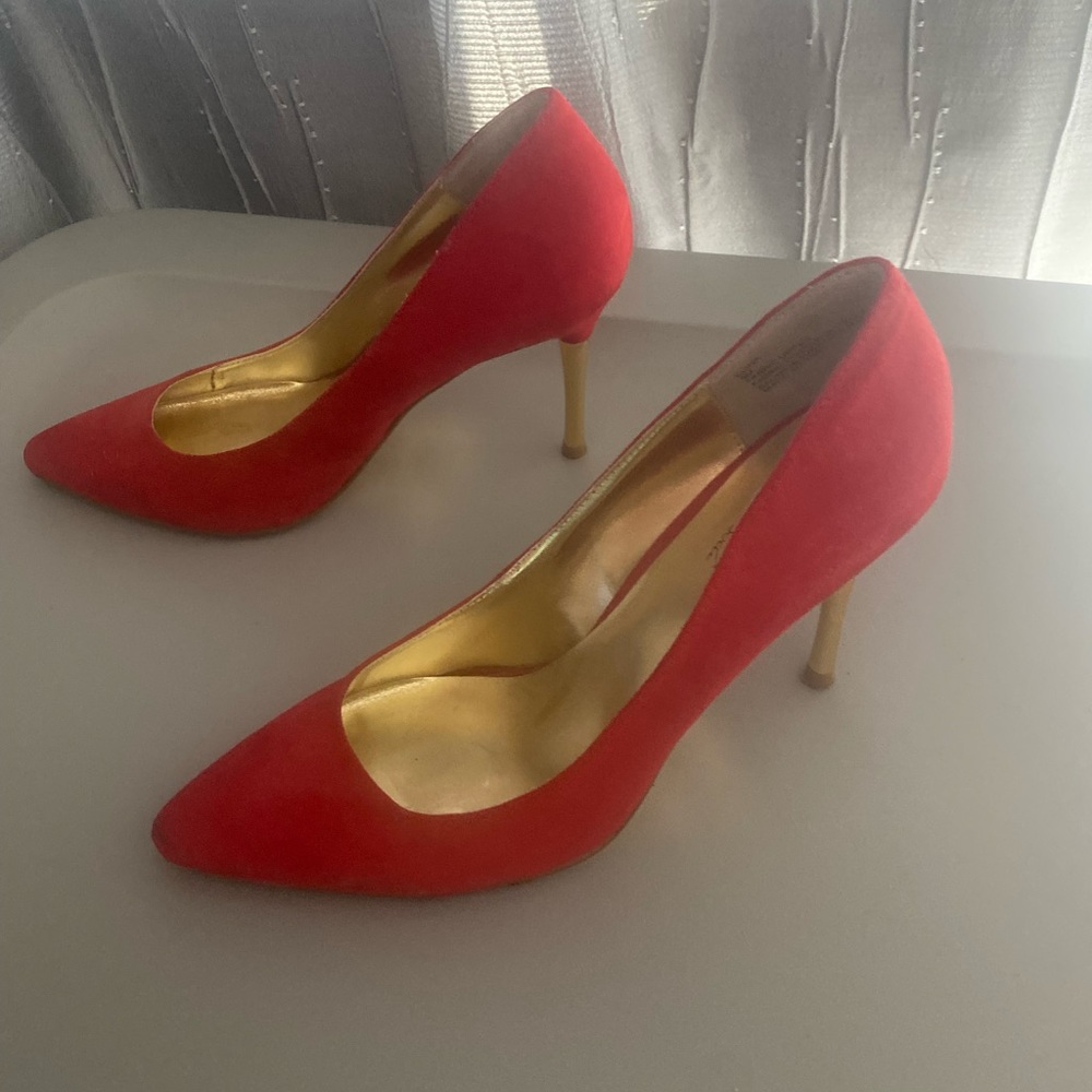 Red suede pumps